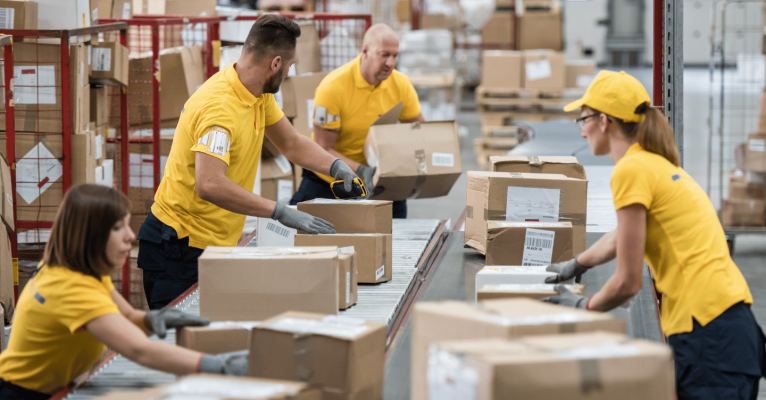 distribution centre personnel sorting packages